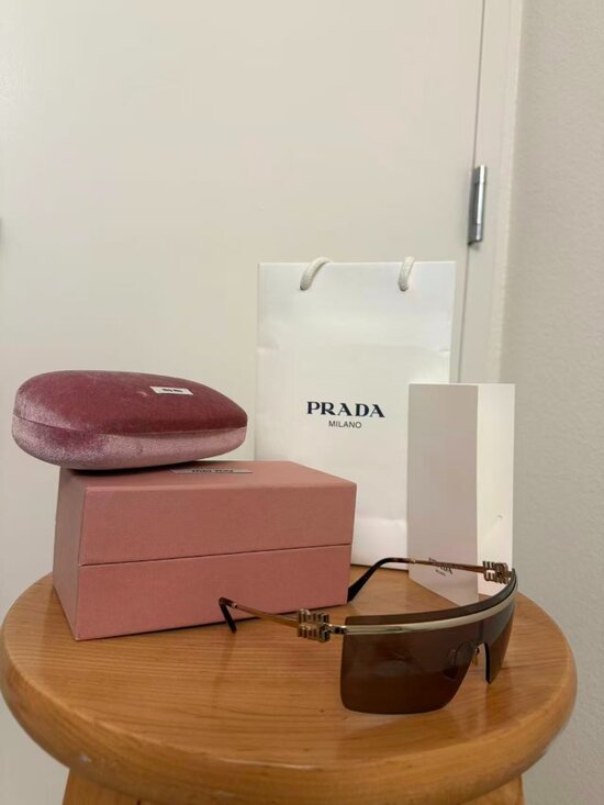 Miu Miu MU50ZS rimless metal shield sunglasses with brown tinted lenses main image 8